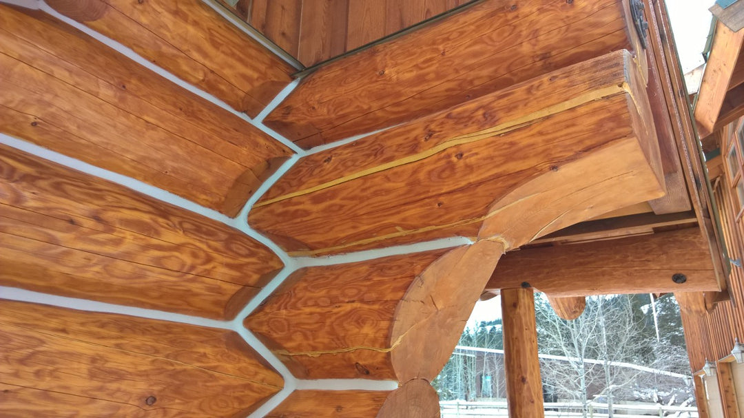 Log home stained with Lovitt's Emerald Gold modified oil stain